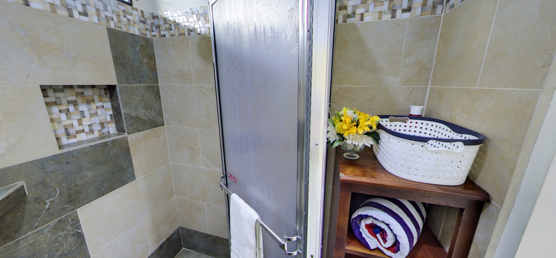 Walk-in shower with mosaic-tile accent