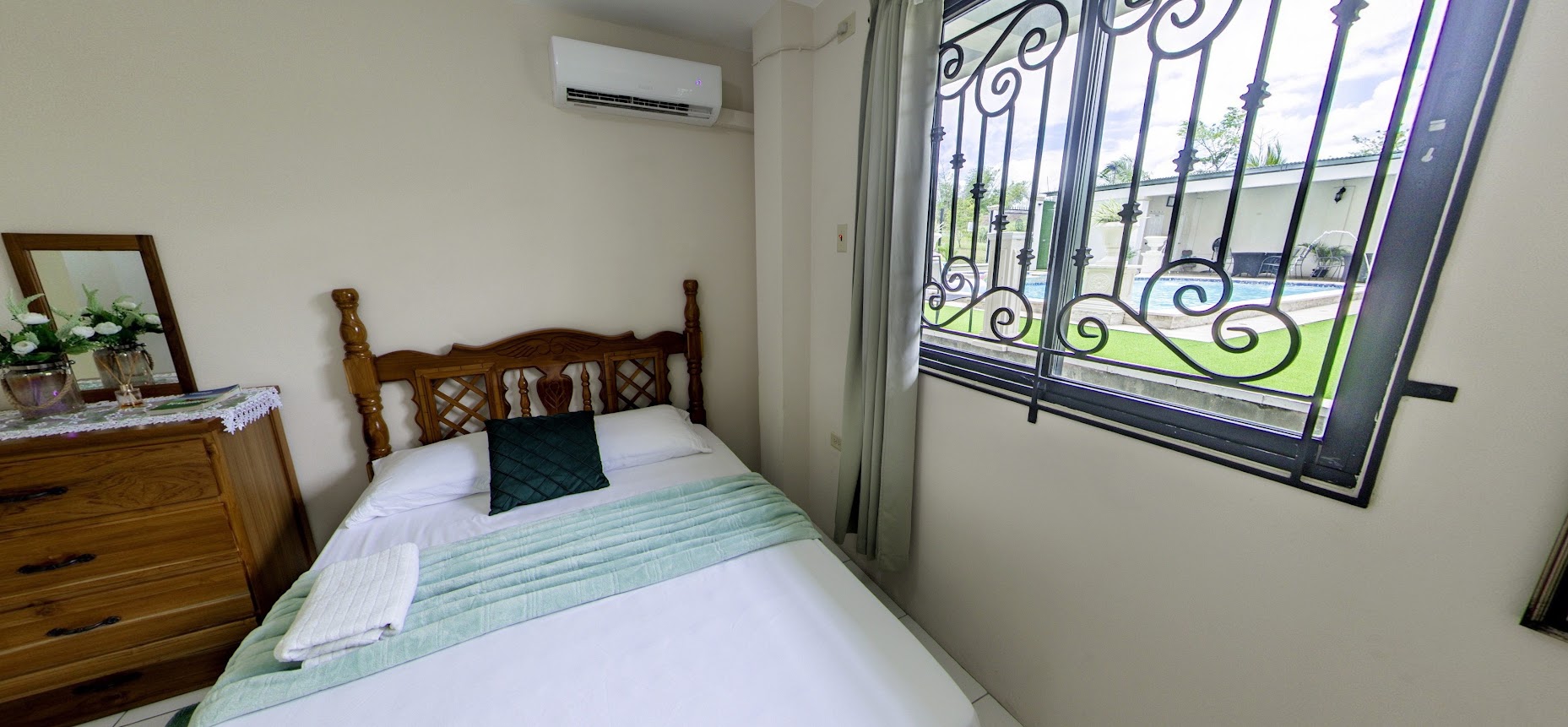 Bedroom with poolside window view